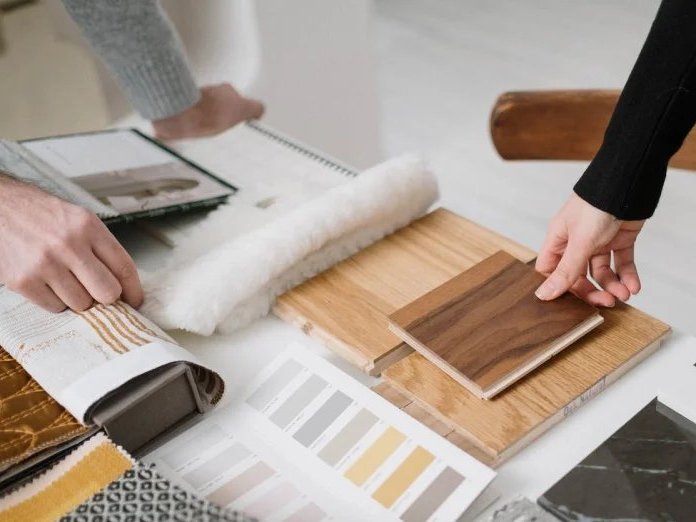 Comparing flooring samples by Diamondback Flooring